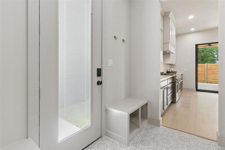 Mudroom has decorative ceramic tile floors and built in space to hide the things you want to tuck away. Mudroom has decorative ceramic tile floors and built in space to hide the things you want to tuck away.