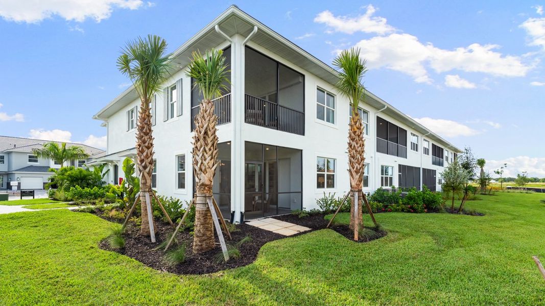 Front exterior of a new home in Esplanade by the Islands Coach Homes, Naples, FL, highlighting curb appeal (Image 2).