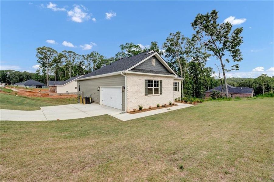 Front exterior of a new home in Tuscany Hills, Douglasville, GA, highlighting curb appeal (Image 2). Front exterior of a new home in Tuscany Hills, Douglasville, GA, highlighting curb appeal (Image 2).
