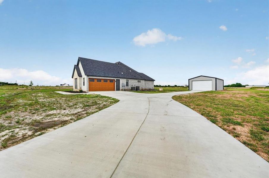 Front exterior of a new home in , Justin, TX, highlighting curb appeal (Image 24).