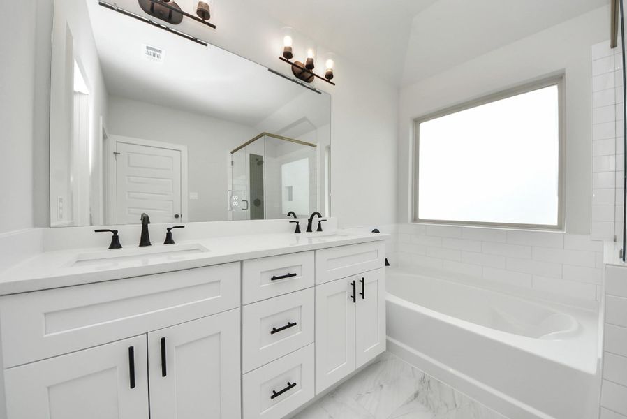 Primary bath, soaking tub, double sink, stand up shower