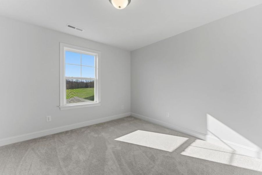 Representative unfurnished interior of a home built from the Fairfield Lux by Keystone Homes NC in Weybridge, Burlington (Image 108).