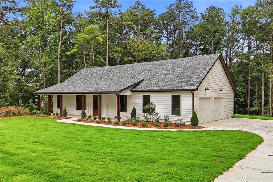 Front exterior of a new home in , Canton, GA, highlighting curb appeal (Image 2). Front exterior of a new home in , Canton, GA, highlighting curb appeal (Image 2).