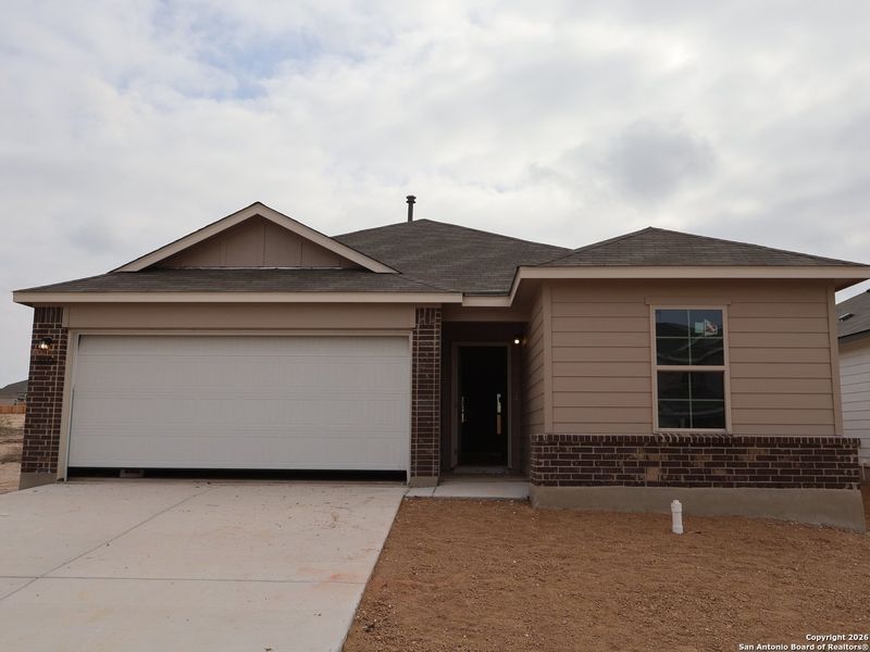 Front exterior of a new home in Agave, San Antonio, TX, highlighting curb appeal (Image 20).