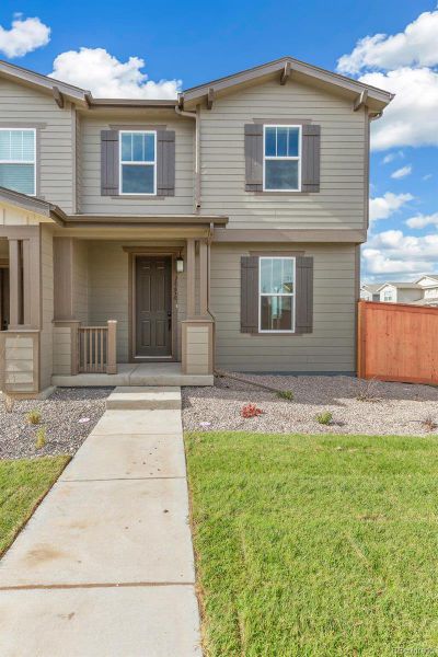 Front exterior of a new home in Sky Ranch Villas, Watkins, CO, highlighting curb appeal (Image 18). Front exterior of a new home in Sky Ranch Villas, Watkins, CO, highlighting curb appeal (Image 18).