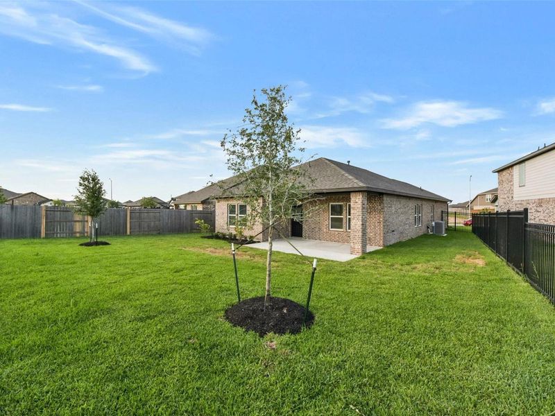 Exterior details and patio area of a home in Sunterra, Katy (Image 23).