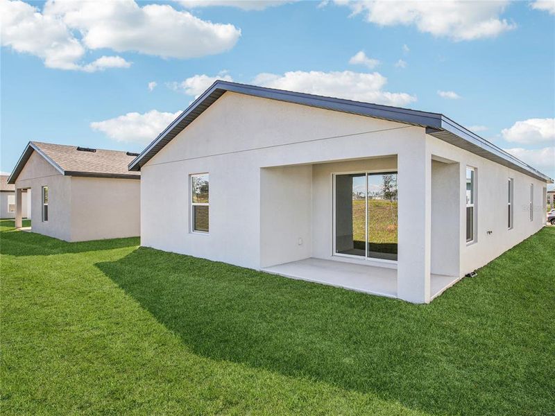 Exterior details and patio area of a home in Trilby Crossing, Brooksville (Image 3).