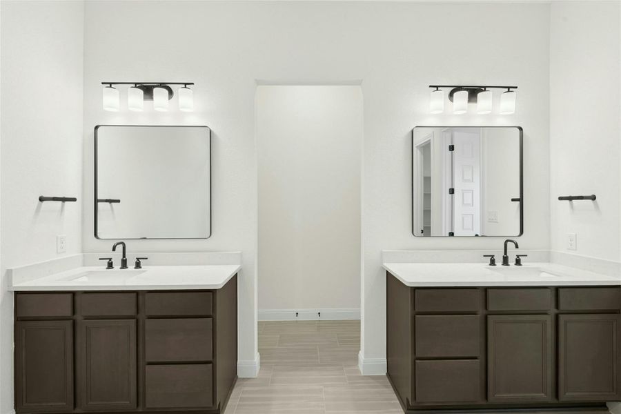 Bathroom featuring two vanities