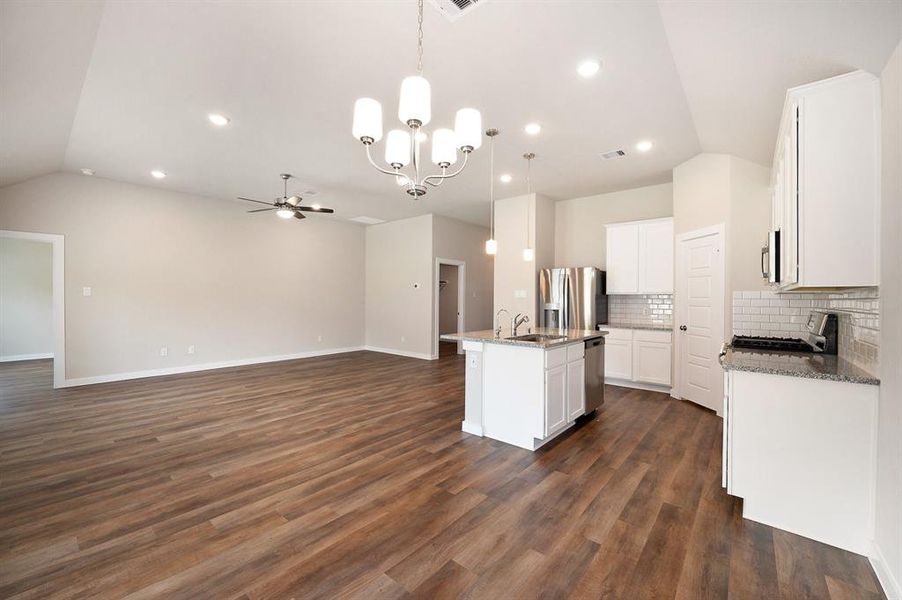 Open concept living space/ kitchen /dining area.