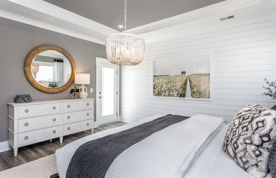 Owner's Suite on the first floor. Model Home Representation.
