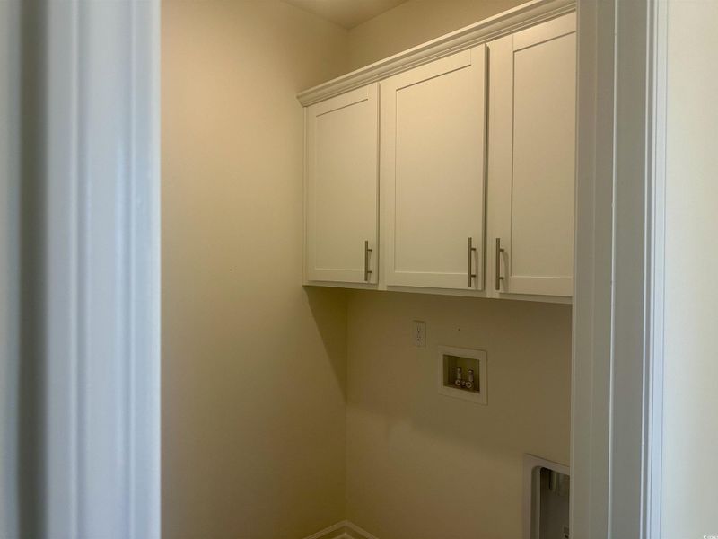 Laundry room featuring cabinet space and hookup for a washing machine