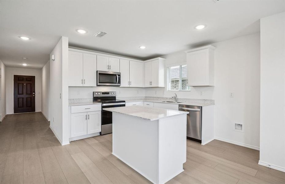 Airy kitchen with ample cabinet space