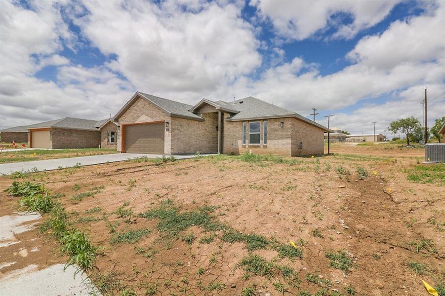 Front exterior of a new home in , Coleman, TX, highlighting curb appeal (Image 2). Front exterior of a new home in , Coleman, TX, highlighting curb appeal (Image 2).