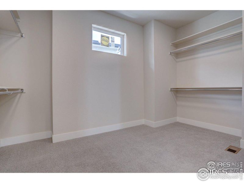 Very large primary bedroom closet