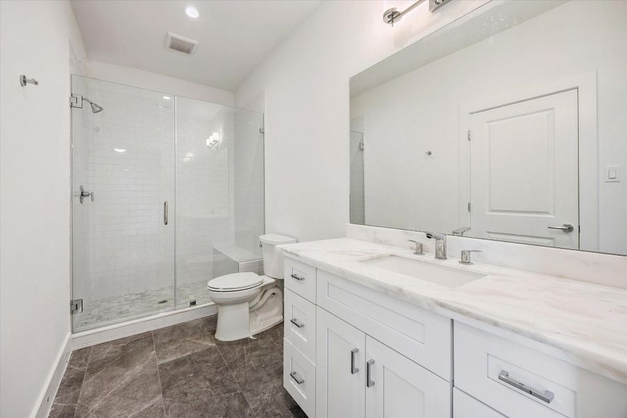 En-Suite Bathroom for the First Floor Bedroom * Porcelain Tile * OVERSIZED Frameless Shower. En-Suite Bathroom for the First Floor Bedroom * Porcelain Tile * OVERSIZED Frameless Shower.