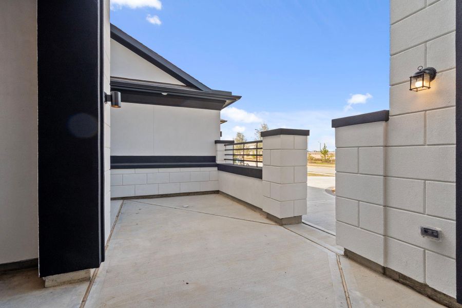 Representative example of how the home will look. Spectacular entry courtyard welcomes guests.