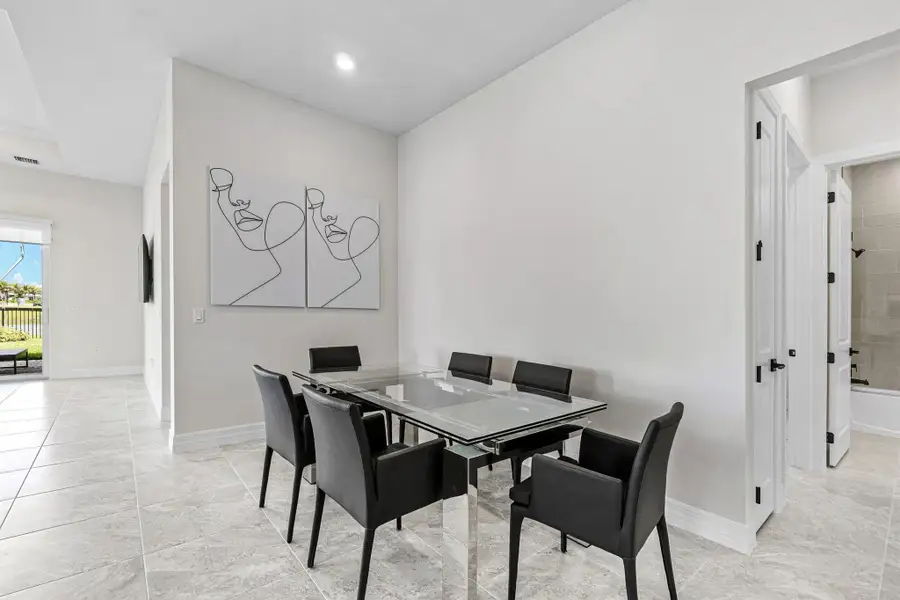 Front exterior of a new home in Avondale at Avenir, Palm Beach Gardens, FL, highlighting curb appeal (Image 23).