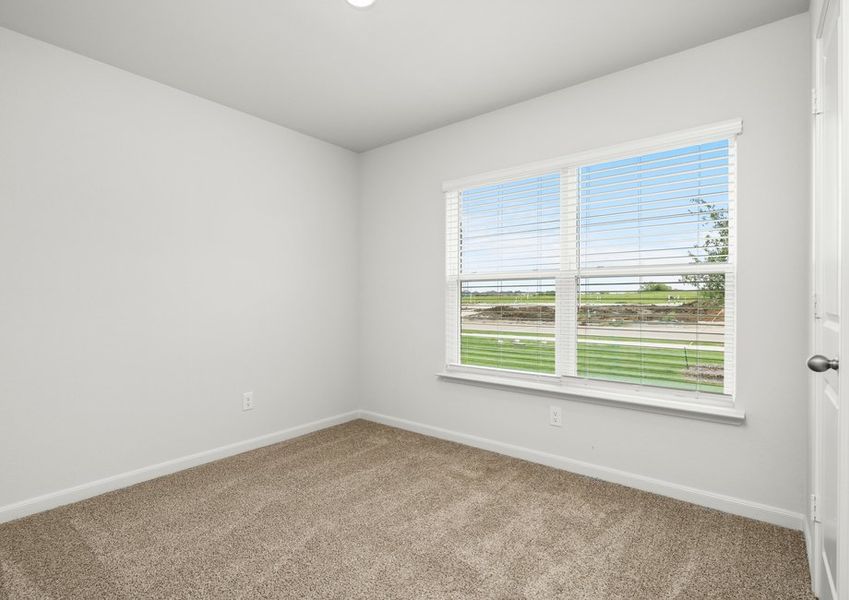 The master bedroom has a large window.
