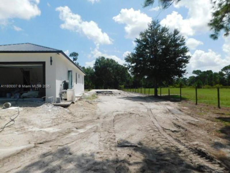 Front exterior of a new home in , Clewiston, FL, highlighting curb appeal (Image 16). Front exterior of a new home in , Clewiston, FL, highlighting curb appeal (Image 16).