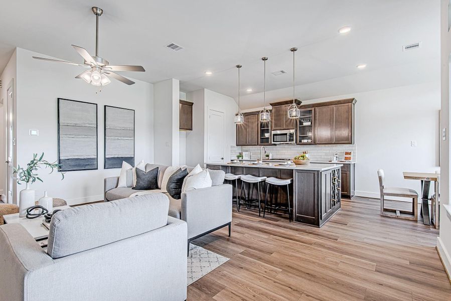 This spacious living room offers a clear sightline into the gourmet kitchen and cozy dining nook, creating an airy, connected feel that's perfect for everyday comfort and hosting alike. This spacious living room offers a clear sightline into the gourmet kitchen and cozy dining nook, creating an airy, connected feel that's perfect for everyday comfort and hosting alike.