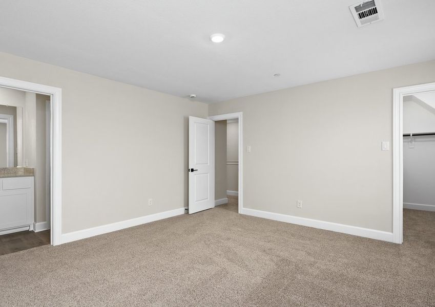 The master suite has a large bedroom, ensuite bathroom and walk-in closet.