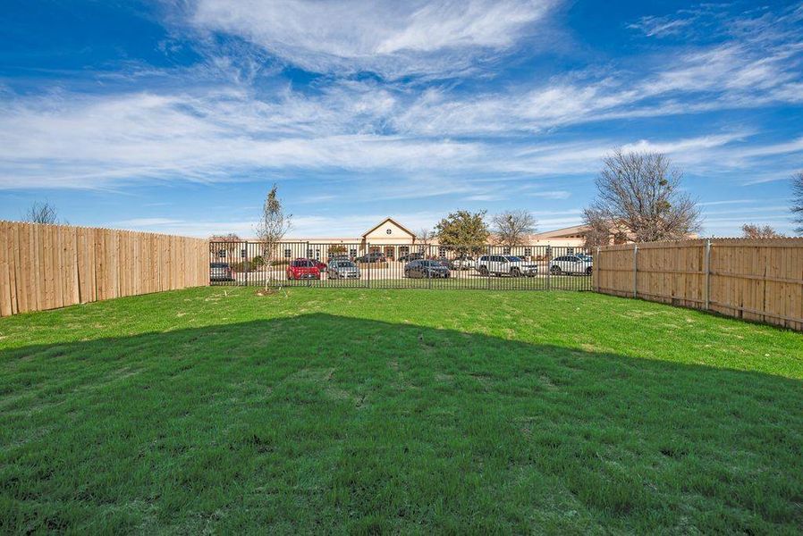 View of yard featuring a fenced backyard