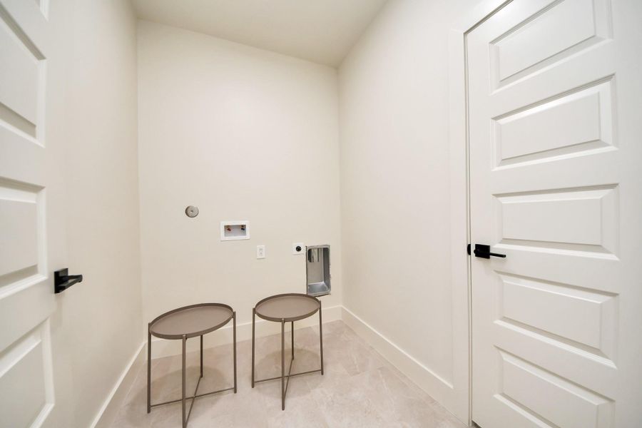 Spacious utility room with a versatile storage closet
