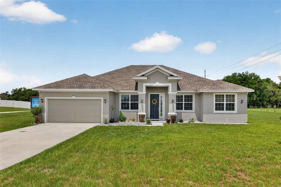 Front exterior of a new home in , Bartow, FL, highlighting curb appeal (Image 1). Front exterior of a new home in , Bartow, FL, highlighting curb appeal (Image 1).