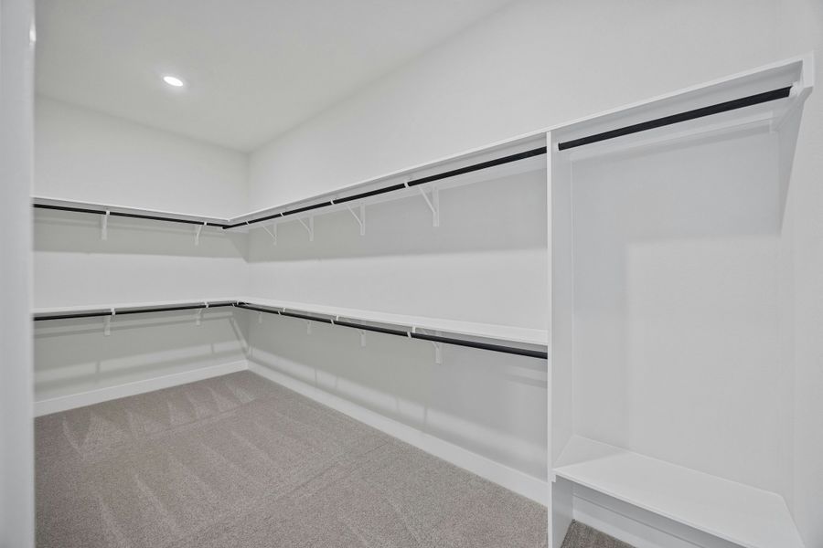 Spacious, unfurnished interior of a new home in Caliterra, Dripping Springs (Image 27).