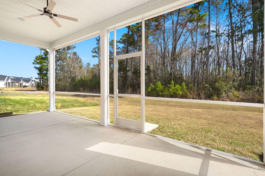 Exterior details and patio area of a home in Summerwind Crossing at Lakes of Cane Bay, Summerville (Image 3).