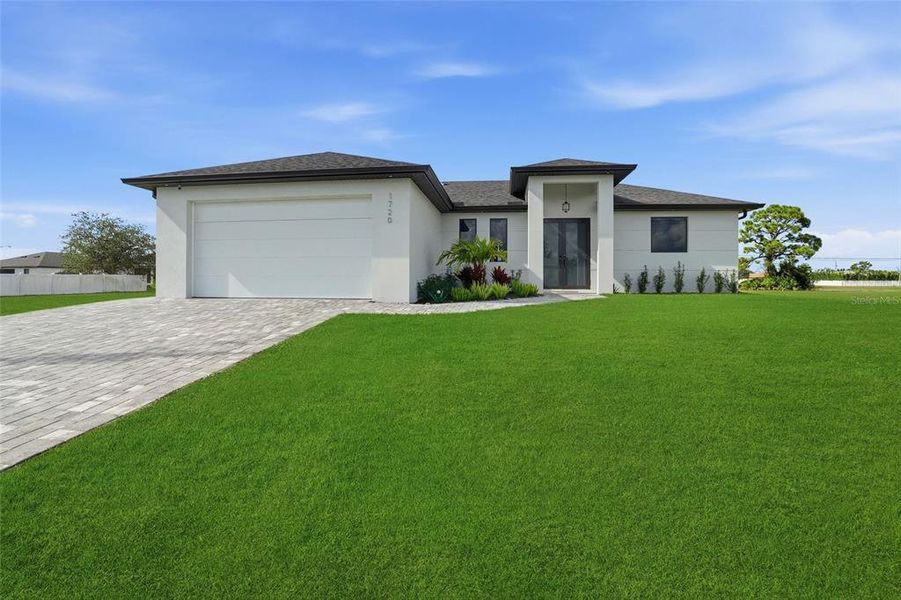 Front exterior of a new home in , Cape Coral, FL, highlighting curb appeal (Image 25).