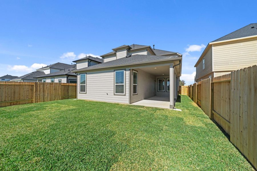Exterior details and patio area of a home in Grand Oaks Village, Houston (Image 4).