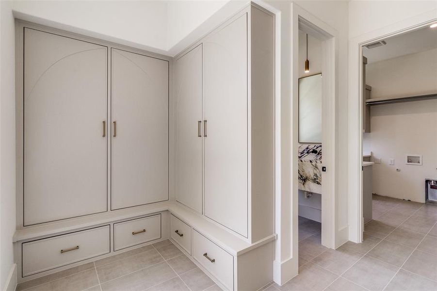 Mudroom featuring light tile patterned flooring Mudroom featuring light tile patterned flooring