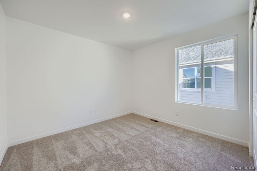 Spacious, unfurnished interior of a new home in Percheron: The Explorer Collection, Colorado Springs (Image 11).