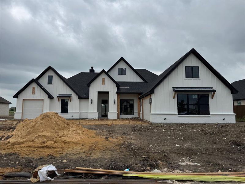 In-progress construction of a new home in Coyote Crossing, Godley, TX (Image 12).