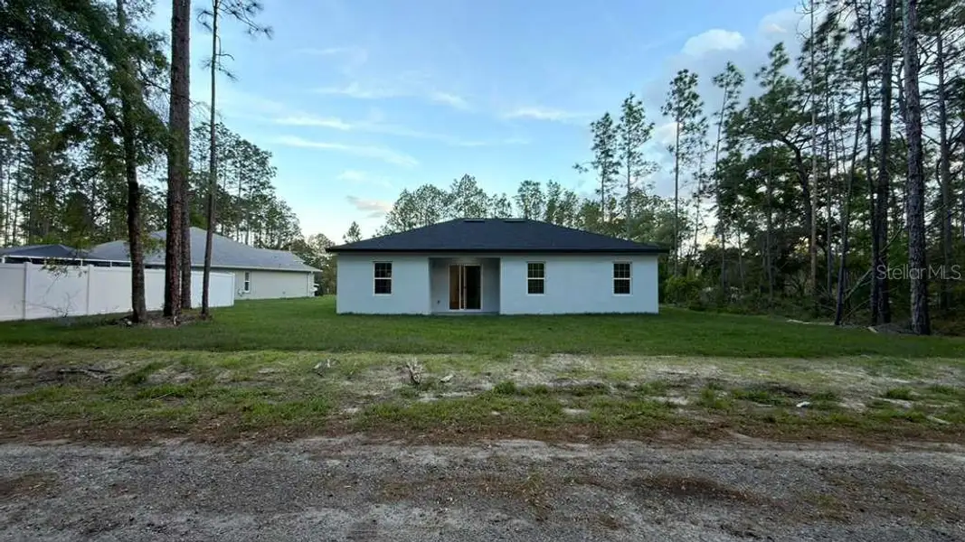 Exterior details and patio area of a home in , Citrus Springs (Image 3).