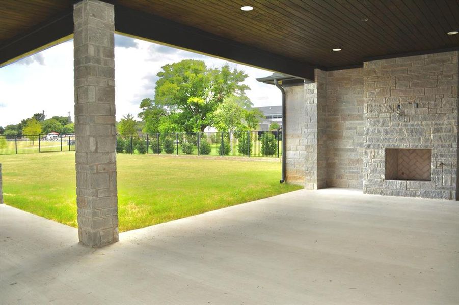 View of patio with fireplace