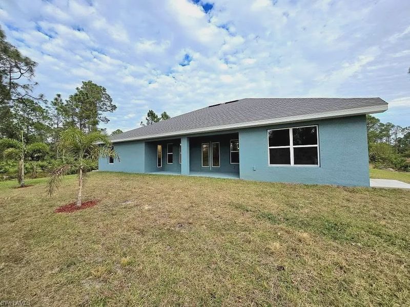 Front exterior of a new home in Lehigh Acres, Lehigh Acres, FL, highlighting curb appeal (Image 10).