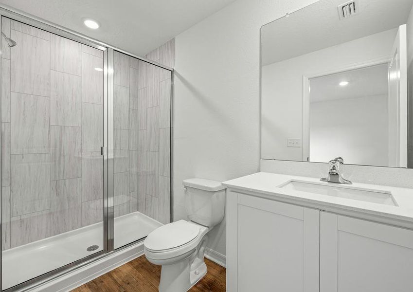 The master bedroom with gorgeous tile detail in the shower.