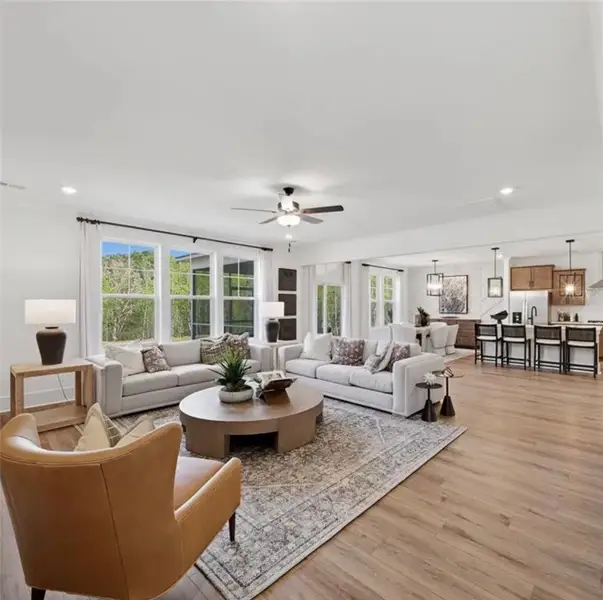 An airy great room combines living, dining, and ki An airy great room combines living, dining, and ki