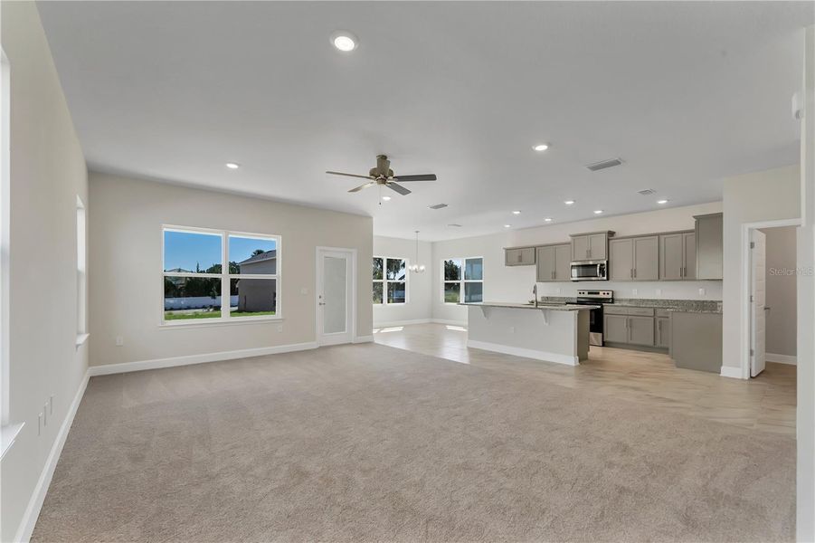 Representative unfurnished interior of a home built from the 2202- by Adams Homes in Winding Oaks, Weeki Wachee (Image 9).