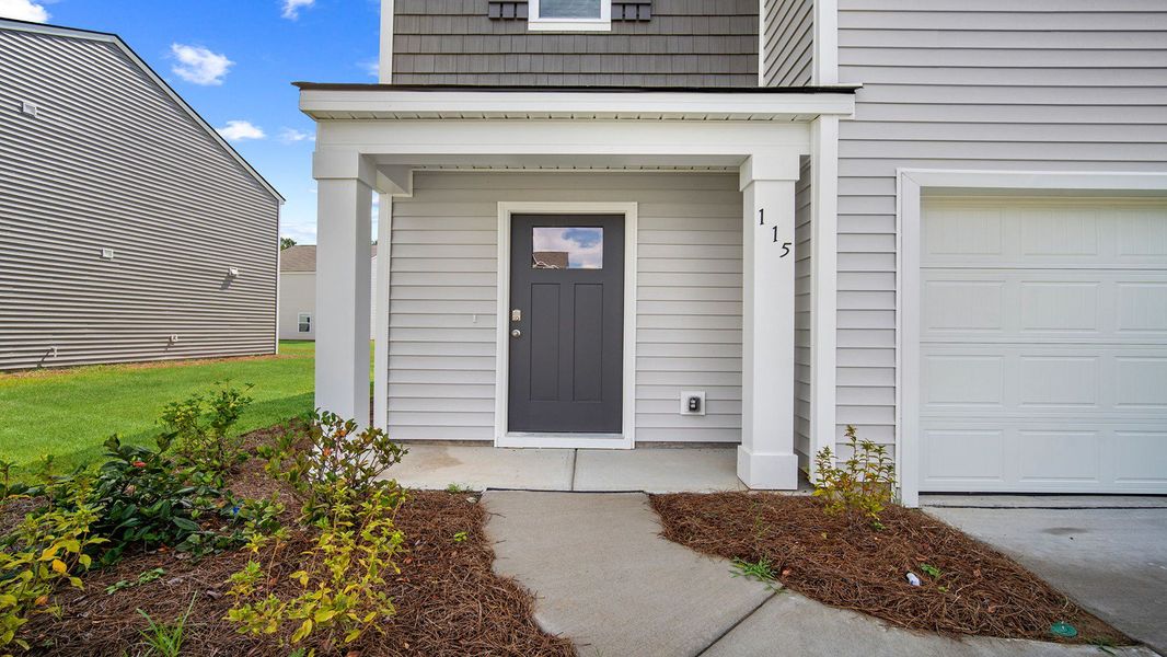 Exterior details and patio area of a home in Cobblestone Village, Savannah (Image 2). Exterior details and patio area of a home in Cobblestone Village, Savannah (Image 2).