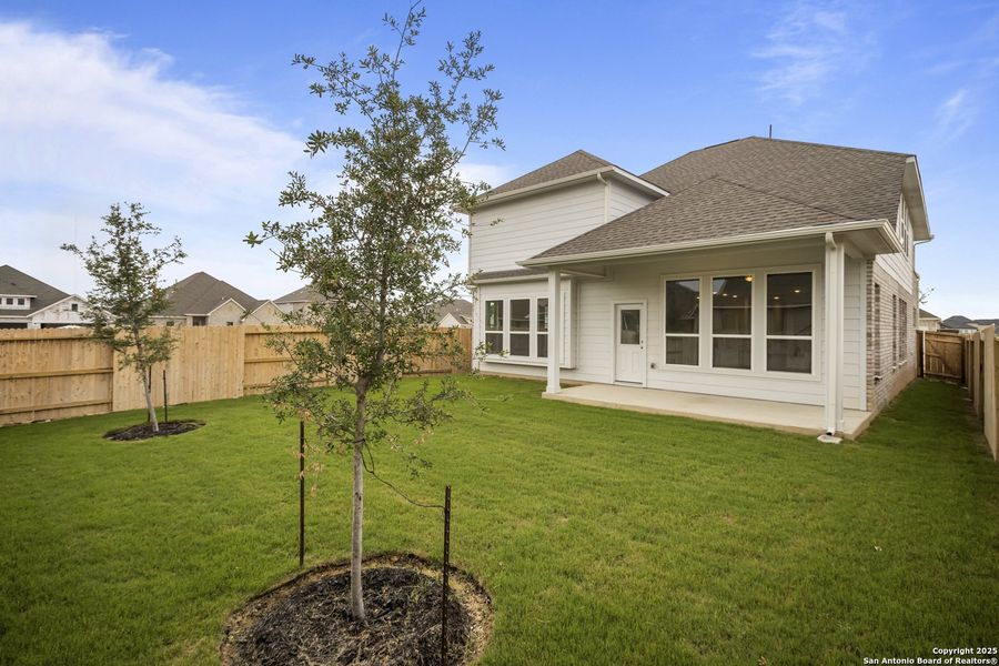Front exterior of a new home in Stillwater Ranch, San Antonio, TX, highlighting curb appeal (Image 1).
