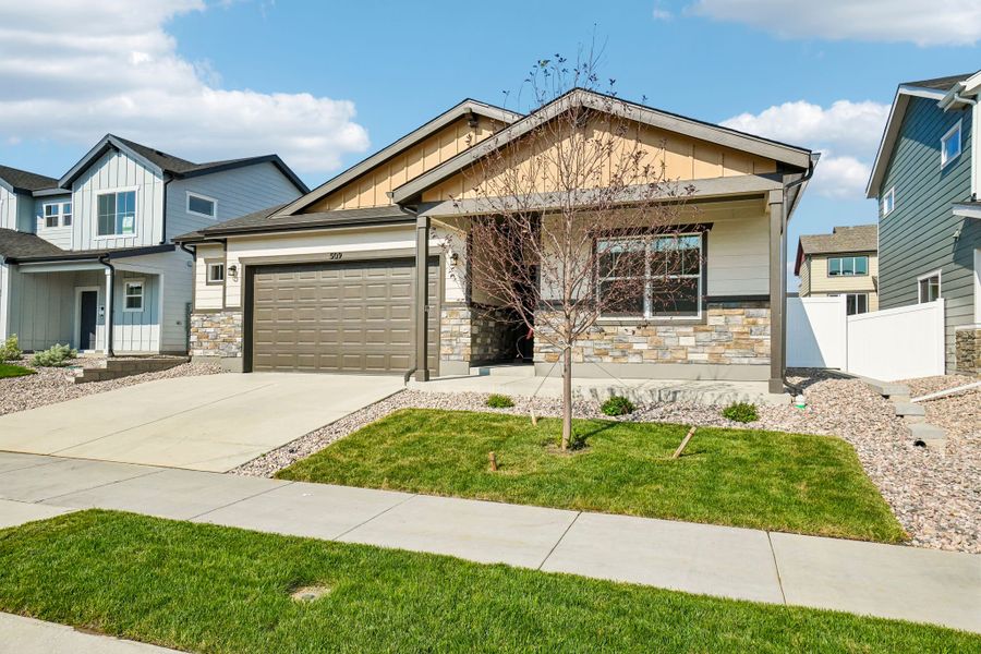 Front exterior of a new home in Union Colony West, Greeley, CO, highlighting curb appeal (Image 27).