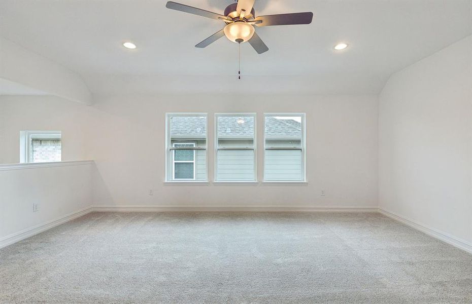 Light-filled loft area providing additional living space  *Real home pictured