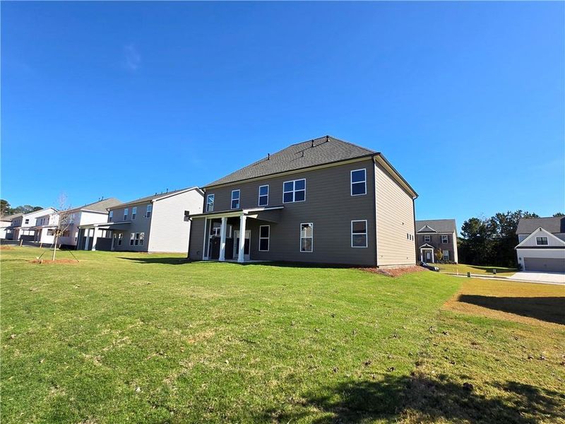 Exterior details and patio area of a home in Enclave at Logan Point, Loganville (Image 22).