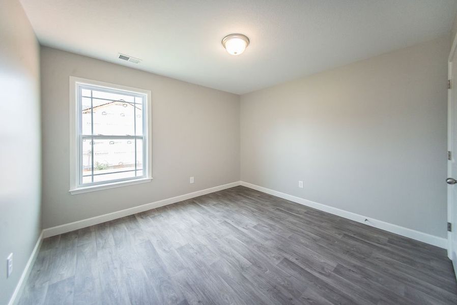 Representative unfurnished interior of a home built from the Beaumont by Enchanted Homes in Guadalupe Heights, Seguin (Image 32).