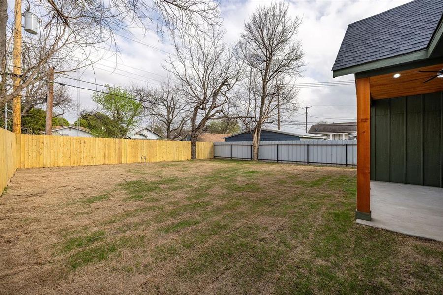 View of fenced backyard