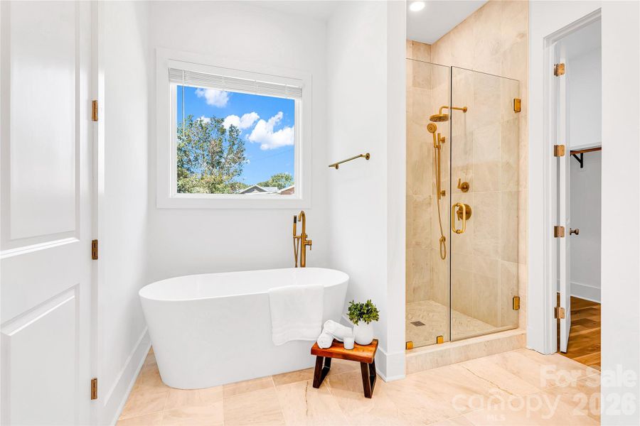 Large Primary Bathroom with soaking tub and walk in closet