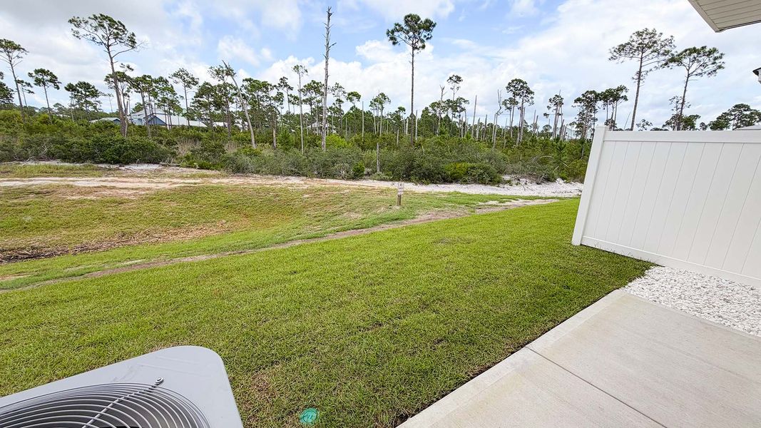 Exterior details and patio area of a home in WindMark Beach, Port Saint Joe (Image 22).